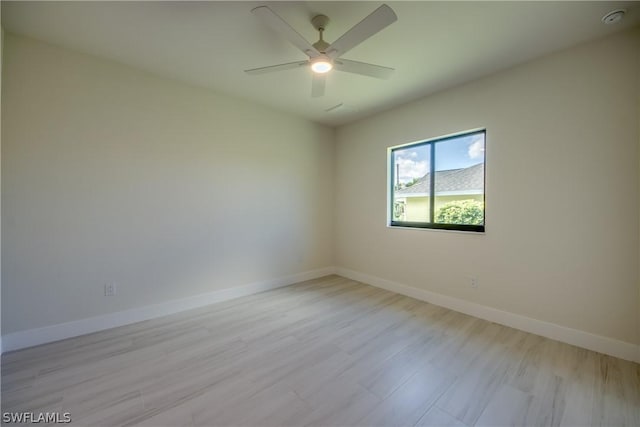 empty room featuring ceiling fan and light wood-type flooring