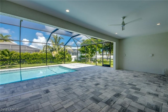 view of pool featuring a patio area, a lanai, and ceiling fan