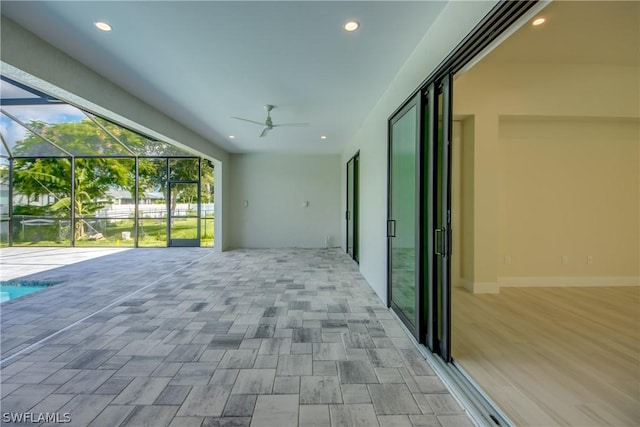 view of patio with a lanai and ceiling fan