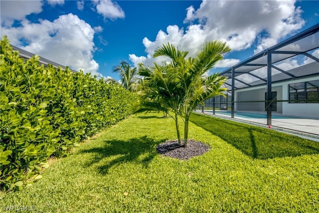 view of yard featuring a lanai