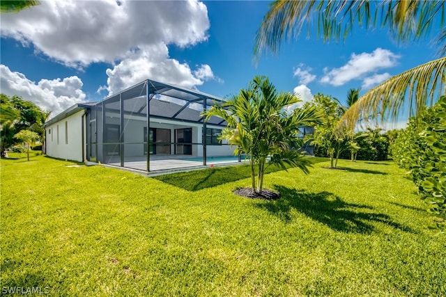 view of yard featuring a lanai and a patio