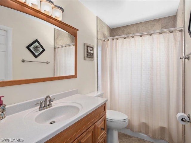 bathroom with toilet, a shower with curtain, vanity, and tile patterned floors