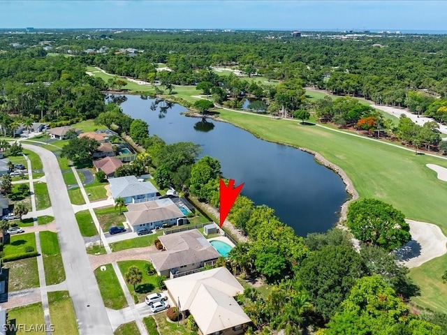 birds eye view of property featuring a water view, a view of trees, and golf course view