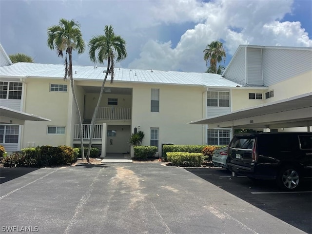 view of building exterior featuring a carport