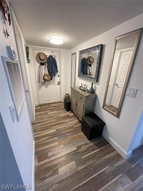 hallway featuring hardwood / wood-style flooring