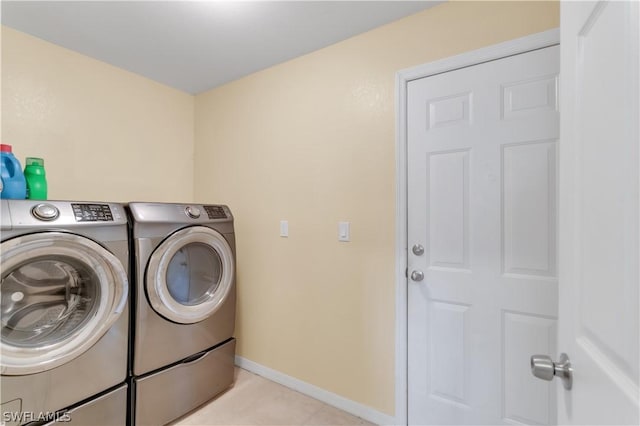 clothes washing area featuring washer and clothes dryer