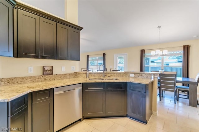 kitchen with sink, light stone counters, stainless steel dishwasher, pendant lighting, and a chandelier