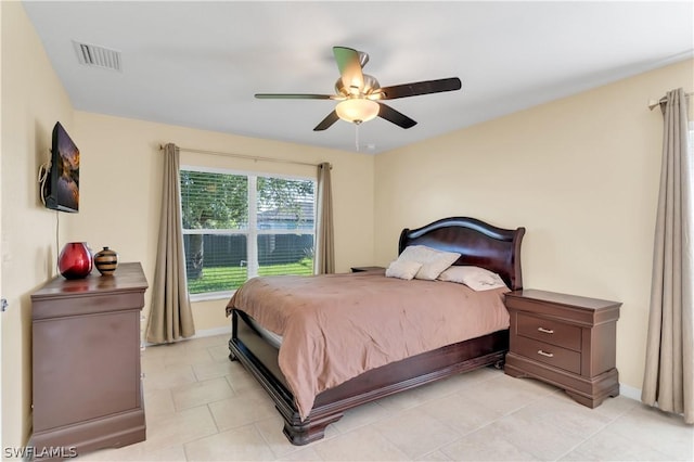 bedroom featuring ceiling fan and light tile patterned flooring