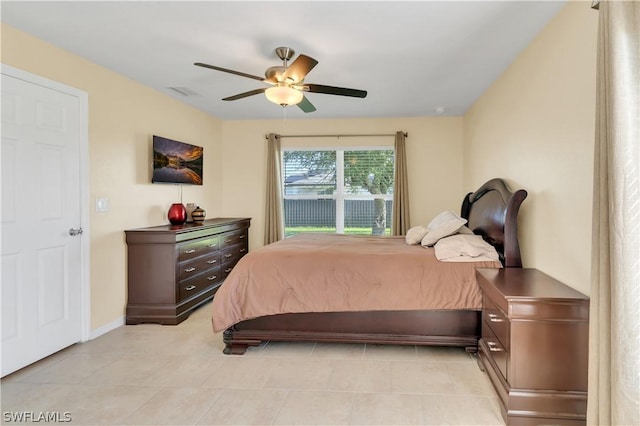 bedroom with light tile patterned floors and ceiling fan