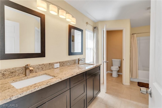 full bathroom featuring tile patterned floors, shower / bath combo, toilet, and vanity