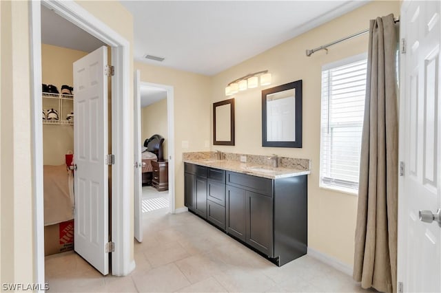 bathroom featuring tile patterned floors and vanity