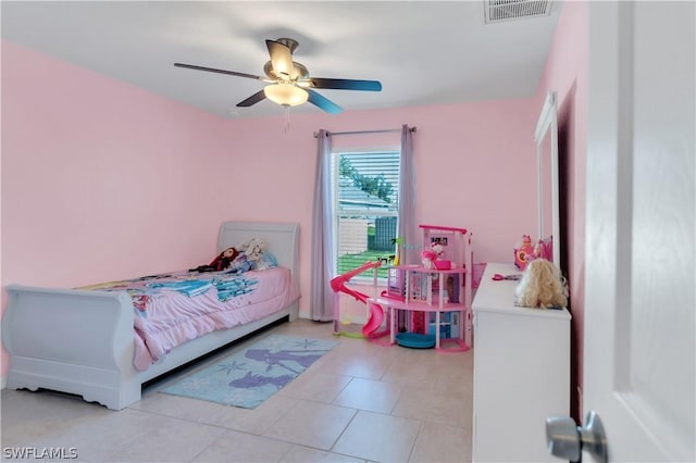 tiled bedroom with ceiling fan