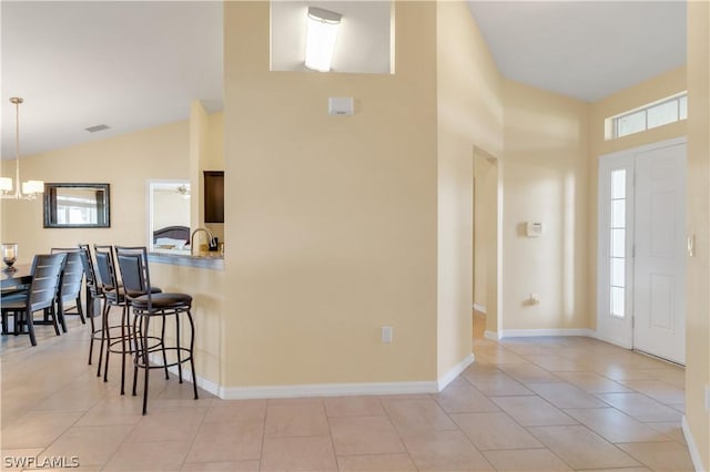 tiled entrance foyer with plenty of natural light and lofted ceiling