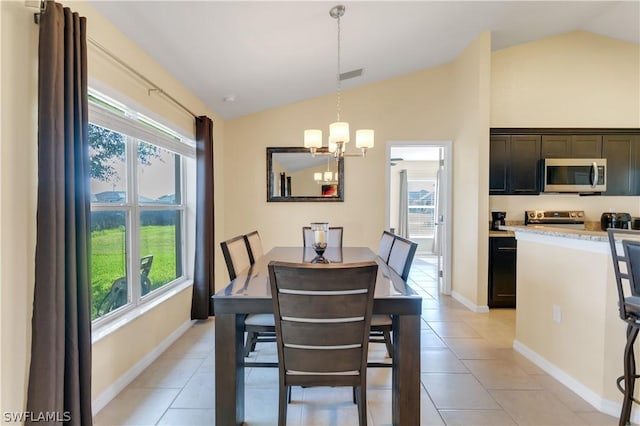 tiled dining space with lofted ceiling, a wealth of natural light, and an inviting chandelier