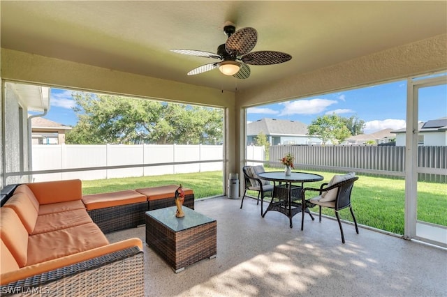 sunroom with ceiling fan