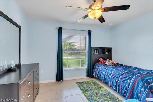 tiled bedroom with ceiling fan