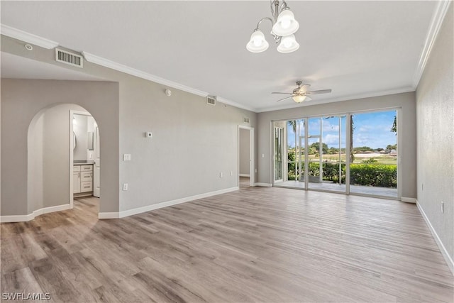 spare room with crown molding, ceiling fan with notable chandelier, and light wood-type flooring