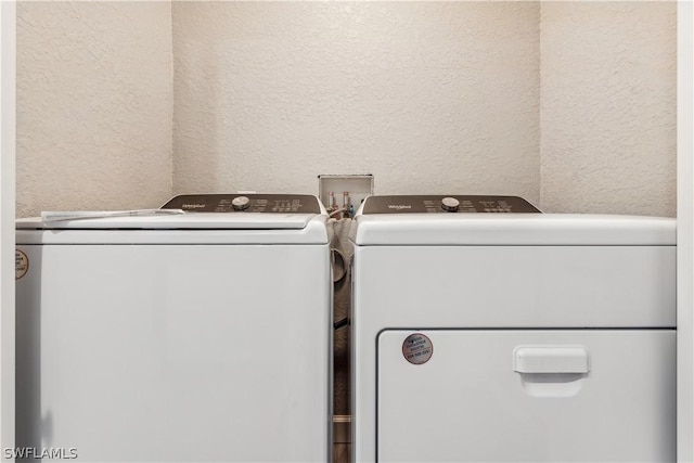 laundry room with separate washer and dryer