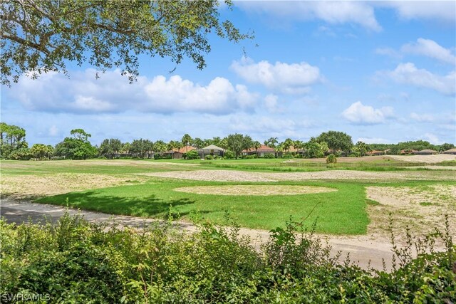 view of property's community featuring a lawn