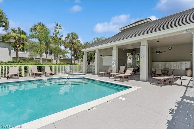 view of pool with a community hot tub, a patio area, and ceiling fan