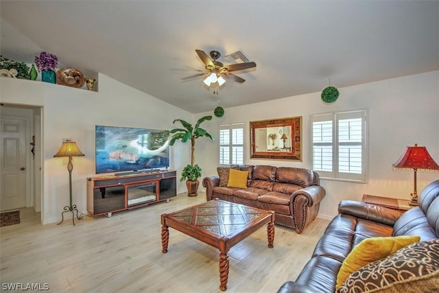 living room with vaulted ceiling, light hardwood / wood-style flooring, and ceiling fan