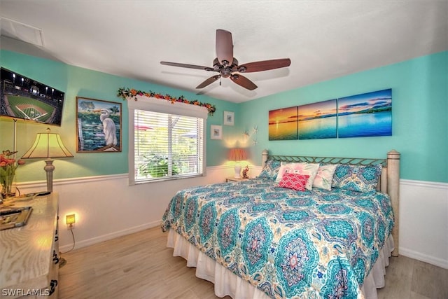 bedroom featuring ceiling fan and light hardwood / wood-style floors