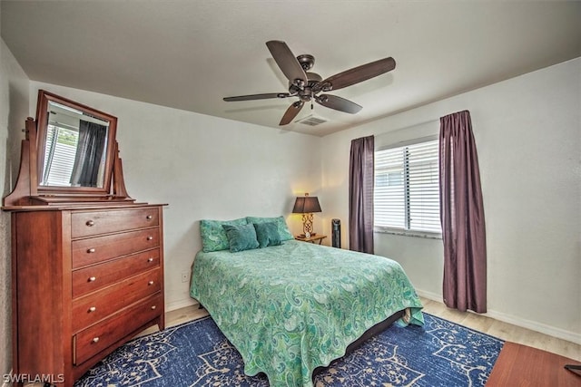 bedroom featuring ceiling fan and light hardwood / wood-style floors