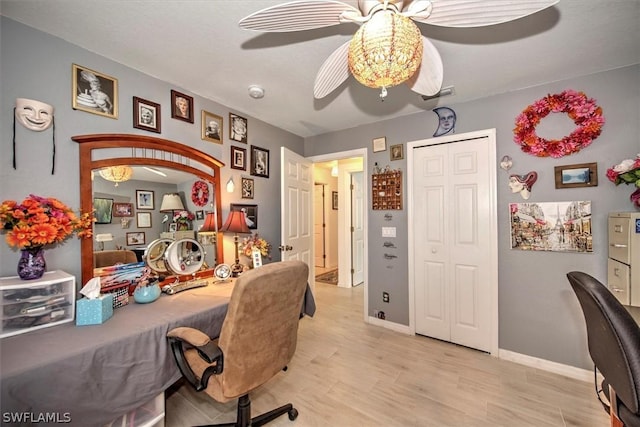 office space with ceiling fan and light hardwood / wood-style flooring