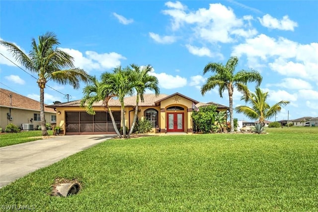 single story home featuring french doors, a front lawn, and central AC unit