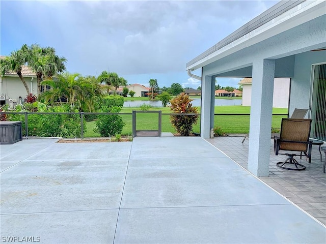 view of patio with a water view