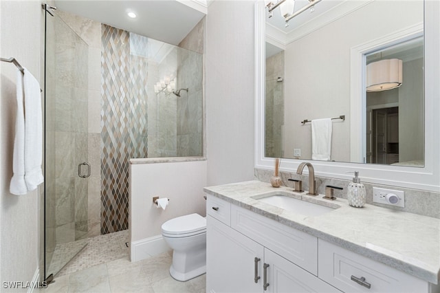 bathroom with vanity, toilet, ornamental molding, and a shower with shower door