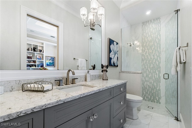 bathroom with vanity, crown molding, a shower with shower door, and toilet