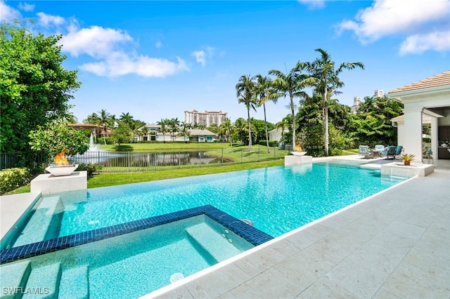 view of swimming pool featuring a patio area, a lawn, and a water view