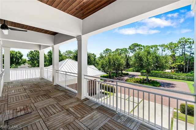 wooden deck featuring ceiling fan