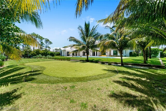 171 N St, Naples, FL 34108 - view of community with a lawn and golf course view