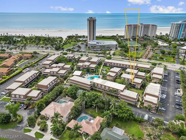 aerial view featuring a water view and a beach view