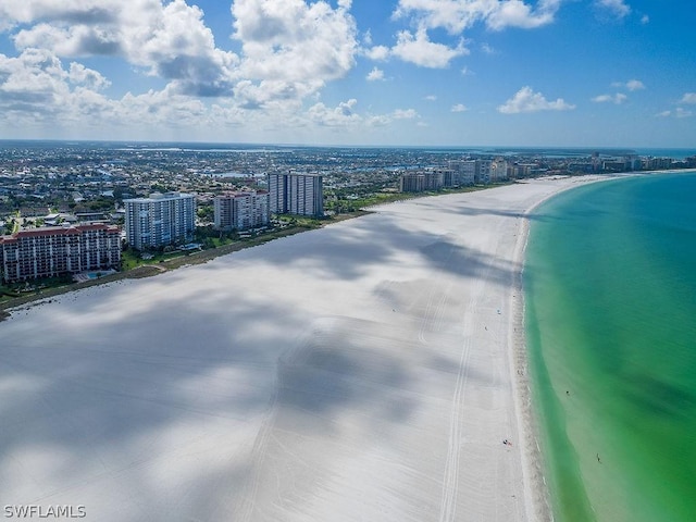 aerial view with a view of the beach and a water view