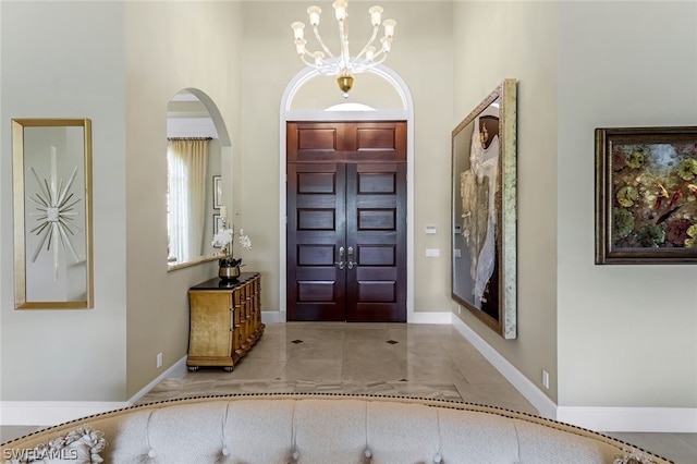 entrance foyer with a notable chandelier