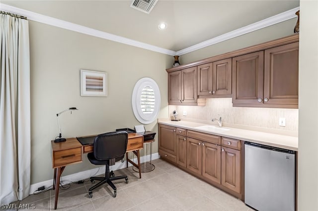 tiled office with crown molding and sink