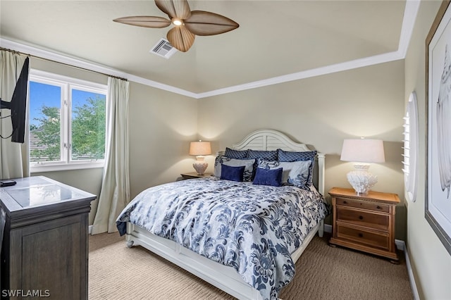 carpeted bedroom with crown molding and ceiling fan