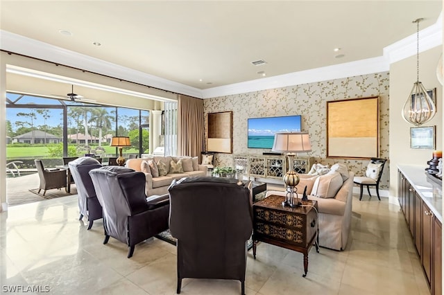 living room with crown molding and ceiling fan with notable chandelier