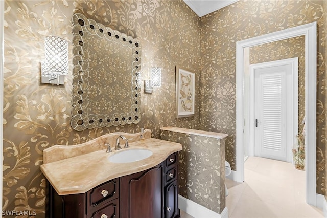 bathroom featuring tile patterned flooring and vanity