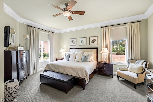 carpeted bedroom with crown molding and ceiling fan