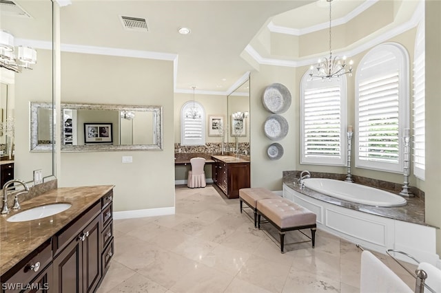 bathroom featuring an inviting chandelier, vanity, crown molding, and a washtub