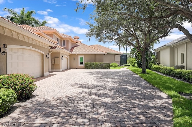 mediterranean / spanish-style house featuring a garage