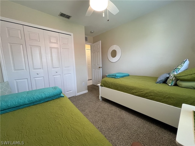 carpeted bedroom with a closet and ceiling fan