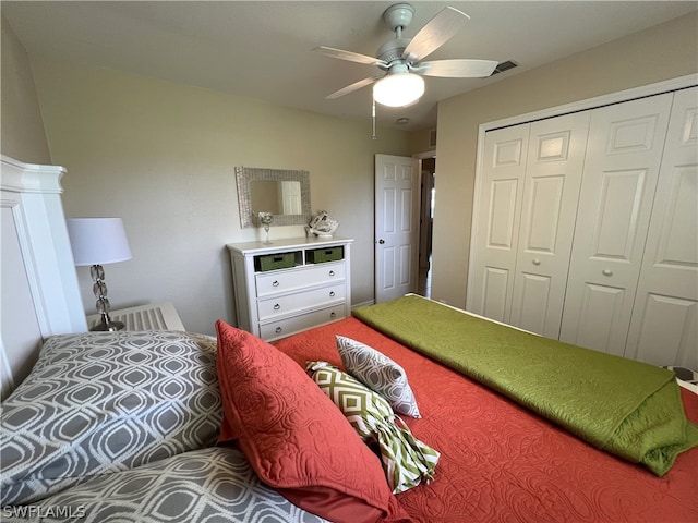 bedroom featuring ceiling fan and a closet