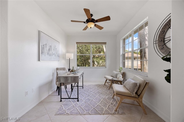 office space with light tile patterned floors and ceiling fan