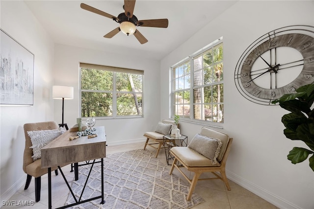 office space with ceiling fan and light tile patterned floors