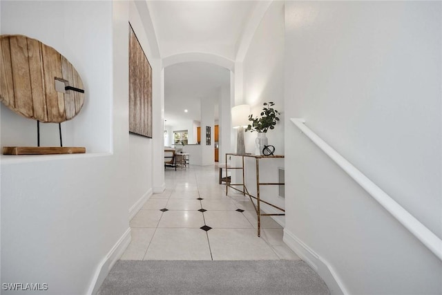 hallway with light tile patterned floors